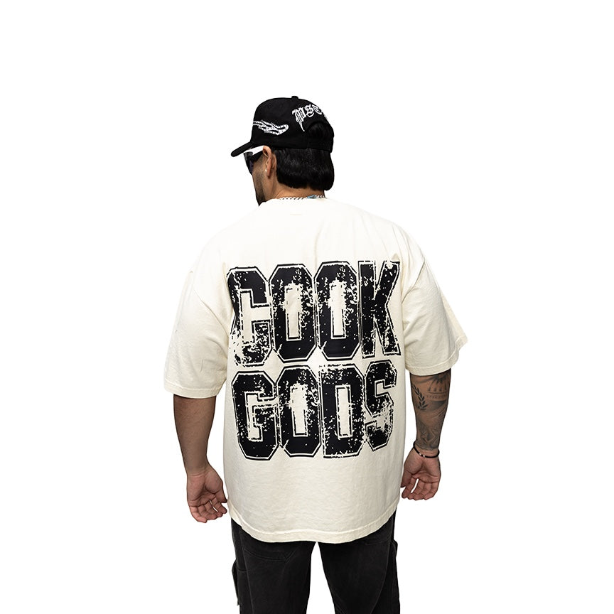Cook Gods cream 100% USA cotton heavyweight t-shirt with distressed black graphic print on back.