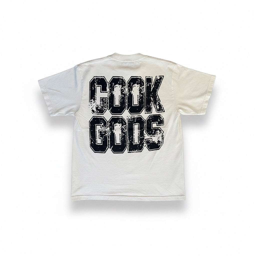 Cook Gods cream 100% USA cotton heavyweight t-shirt with distressed black college-style logo on back.