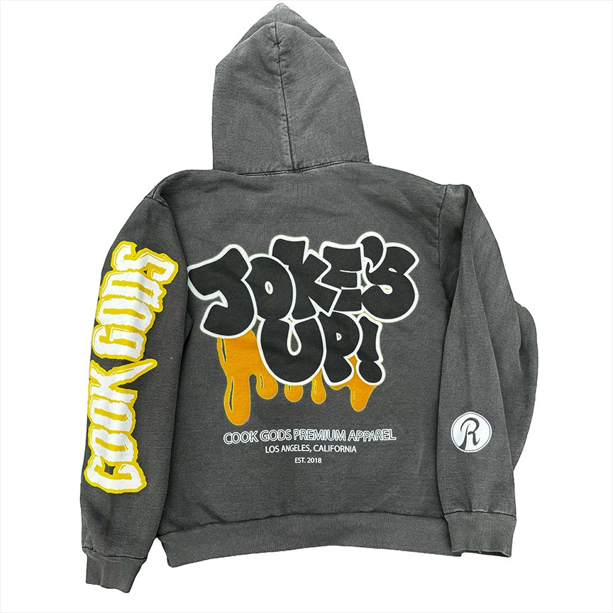 Cook Gods dark grey 100% cotton crop hoodie with "Jokes Up!" graphic and yellow sleeve print.