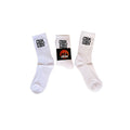 Cook Gods white crew socks with black logo detail. One pair is folded, showing the logo band.